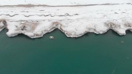 Michigan lake in Winter. Water, cold weather, bird's eye view, drone shots