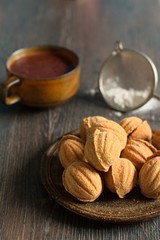 Russian walnut shaped cookies with caramely filling – “Oreshki”