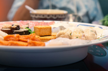 Assort many of Suki Hotpot Shabu set on hot pot, pork, fish, mussel, squid, egg, shrimp, fish ball ,Seaweed ,fish tofu ,woo