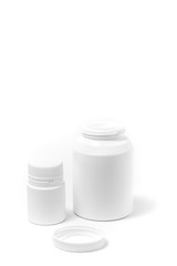 Two bottles of medicine white pills isolated on white