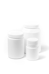 Three bottles of medicine white pills isolated on white