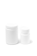 Two bottles of medicine white pills isolated on white