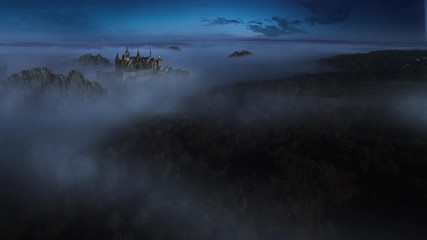 Aerial shot – Fantasy Castle in a foggy forest at night