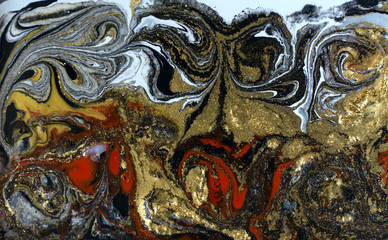 Red and black marbling pattern. Golden marble liquid texture.