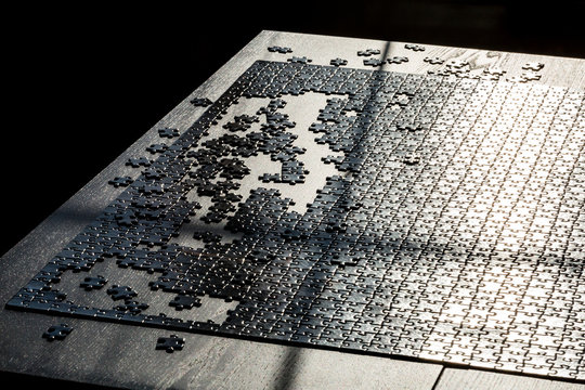 Final of jigsaw puzzle game. Several puzzle pieces are not completed. Concept of success.