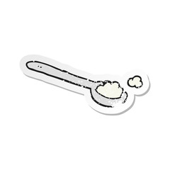 retro distressed sticker of a cartoon teaspoon of salt