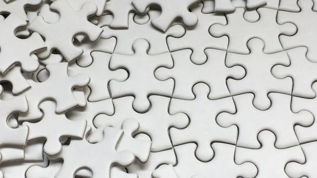 White Jigsaw Puzzle piece put into missing places with white background, Succeed in Business concept, Debt settlement concept.