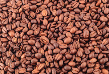 Coffee black beans close up background