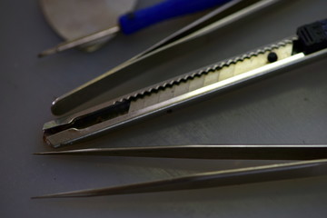 technician repairing broken mobile phone close-up.Close-up Of A Human Hand Repairing Smartphone With Screwdriver Internal circuits and structural elements of mobile phones