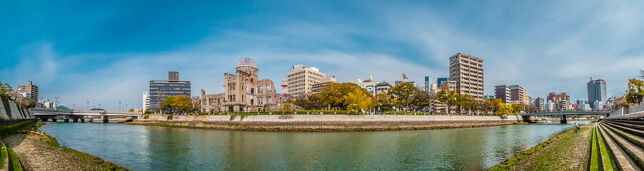 Fototapeta na wymiar Panorama of the Hiroshima Peace Memorial Dome, Hiroshima, Japan, seen from the western bank of the Motoyasu River.