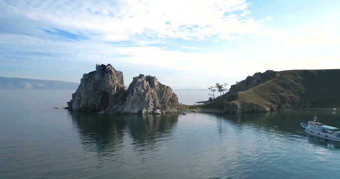 View of the Baikal Bay Shamanka in summer day. Drone footage .A famous tourist site. Symbol of lake Baikal. Cape Burhan