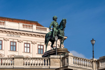 Austria, Vienna, Albrechtsplatz: Front view of world famous Albertina museum palais palace with Albrecht statue in the city center of the Austrian capital with blue sky - concept travel history art