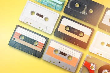 Collection of retro audio tapes on background