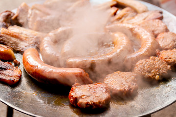 Baking traditional homemade delicious meat on barbecue plate