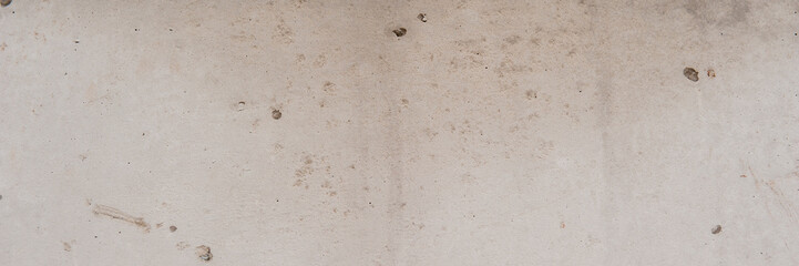gray cement plaster on the wall of the house.