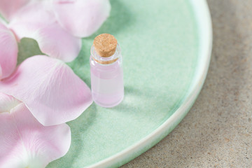 rose water in a glass bottle