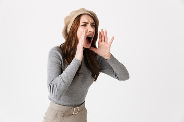 Portrait closeup of aggressive woman 30s wearing hat yelling and looking aside