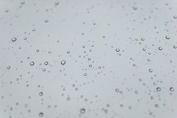 Water drops on clean bright window focused detail