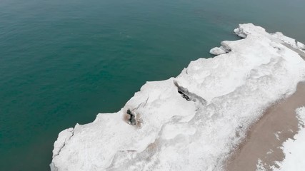 Michigan lake in Winter. Water, cold weather, bird's eye view, drone shots