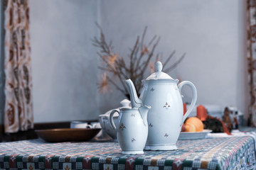 Antique decorative porcelain coffee jug and milk container still life