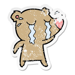 distressed sticker of a cartoon crying bear