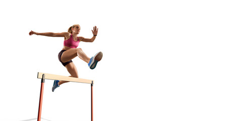 Isolated Female Track and field athlete jumps over the barrier on white background