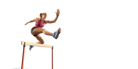 Isolated Female Track and field athlete jumps over the barrier on white background