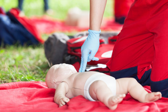 Baby CPR dummy first aid training - Powered by Adobe