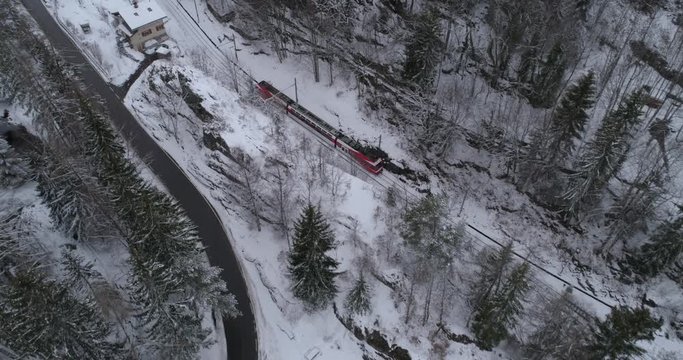 TMR train leaving les Mar&eacute;cottes, form above - Aerial 4K