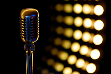 vintage microphone with color background in nightclub