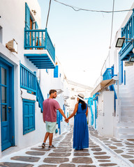Mykonos Greece Island , couple men and woman on vacation in Greece - obrazy, fototapety, plakaty
