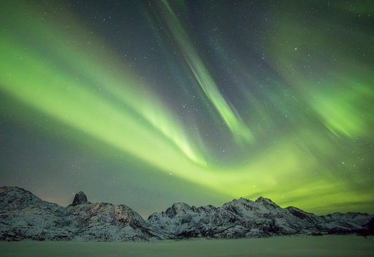 Eidsfjord and Reka Mountain Range in night  under a powerful northern lights Holmstad, Sortland, Vester&aring;len, Norway,Europe