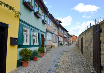 small traditional houses in a street near the Quedlinburg Castle