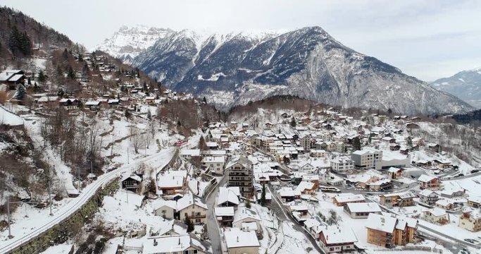 Train TMR pass in Salvan snow fall - Aerial 4K