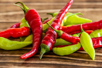 peppers on wood, green and red