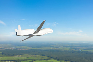 Fototapeta na wymiar Unmanned drone flies air at low altitude, studying the atmosphere and landscape. Elements of this image furnished by NASA.