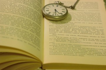 old book and clock