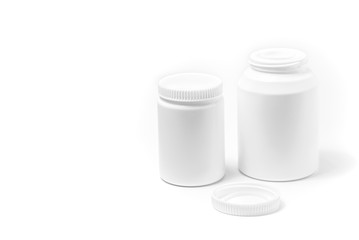 Two bottles of medicine white pills isolated on white