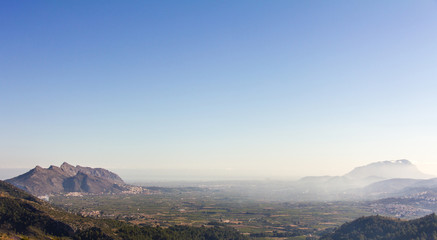 Panoramic view of Rectoria Valley in Marina Alta region, Alicante, Spain. View from Vall de Laguar town. Segaria and Montgó mountains are in the background.