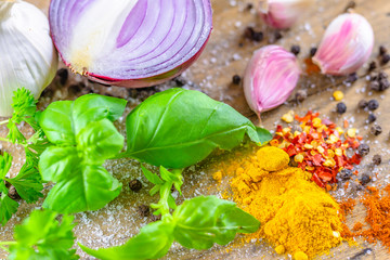 Mixed, Italian cooking ingredients placed on rustic wooden table.