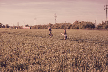 Girls playing around in nature and dogs