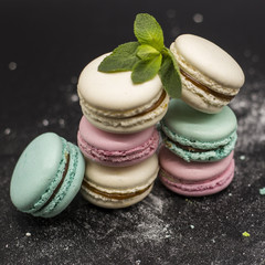 fruit macaroon with mint on black background