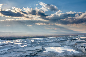 White limestone terraces and pools of Pamukkale, Turkey, in backlight
