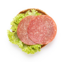 Sandwich with salami sausage on white background.