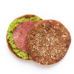 Sandwich with salami sausage on white background.