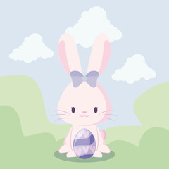 cute rabbit female with egg of easter in landscape