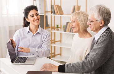 Mature couple meeting with real estate agent