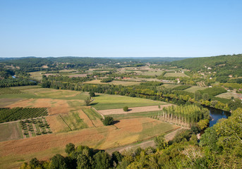 View of fields and meadows in the Dordogne Valley from the walls of the old town of Domme, Dordogne, France