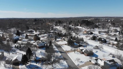 Aerial view of residential houses at winter. American neighborhood, suburb. Real estate, snow, drone shots, from above