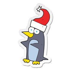 sticker of a cartoon christmas penguin